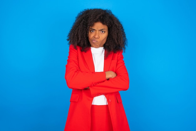 Picture of angry woman crossing arms Looking at camera with disappointed expression