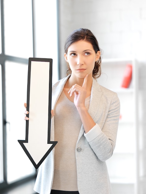 picture of attractive businesswoman with direction arrow sign