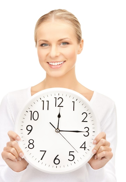 picture of attractive businesswoman with wall clock