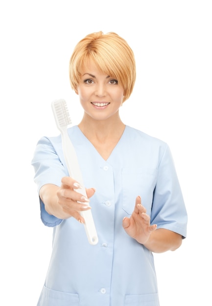 picture of attractive female doctor with toothbrush