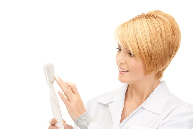 picture of attractive female doctor with toothbrush