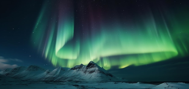 A picture of the aurora borealis above a snowy mountain.