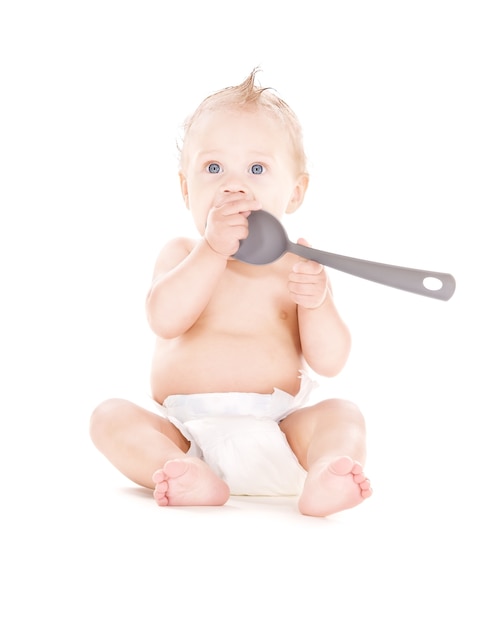 picture of baby boy with big spoon over white