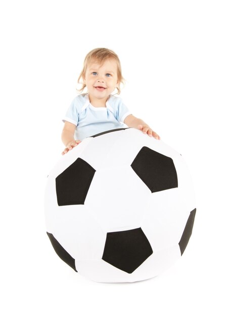 picture of baby boy with soccer ball over white