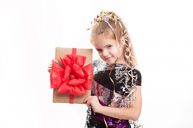 Picture of beautiful girl with gift box on white wall