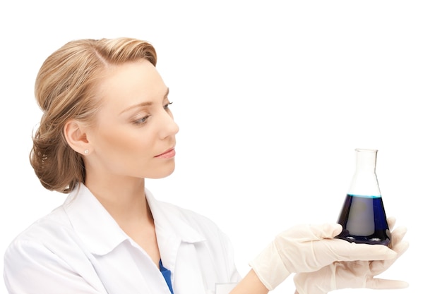 picture of beautiful lab worker holding up test tube