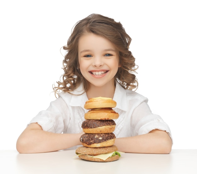 picture of beautiful little girl with junk food