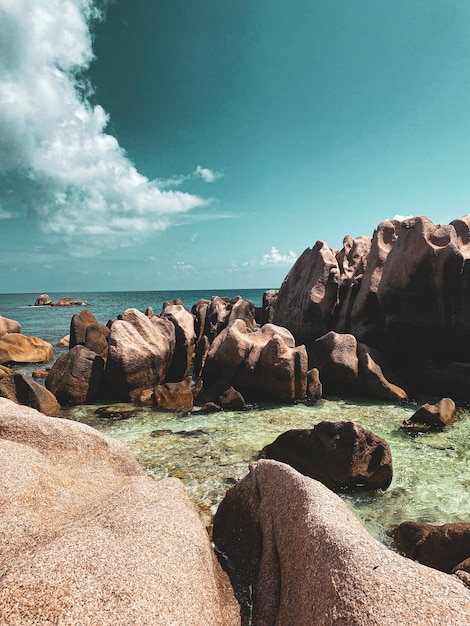 Picture of beautiful Seychelles Beach with big Rocks and crystal water and Blue Sky