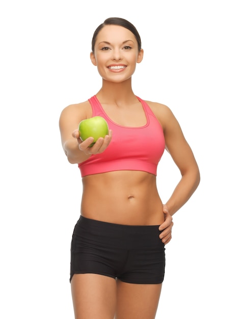 picture of beautiful sporty woman with apple