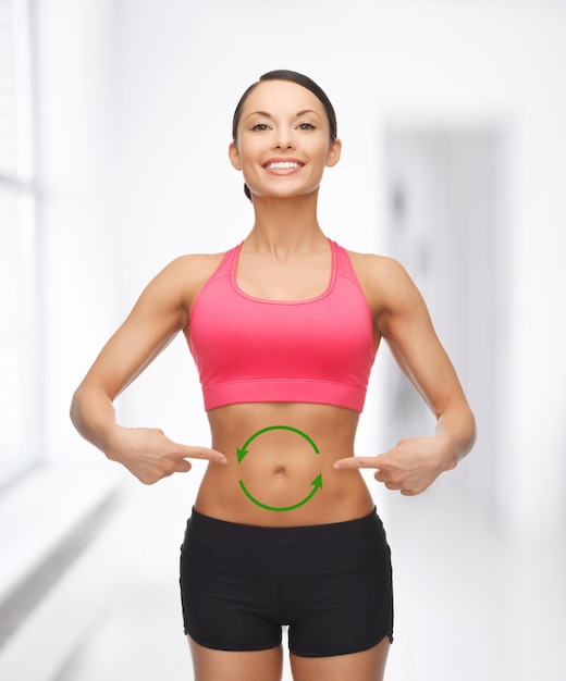 picture of beautiful sporty woman with arrows on her stomach