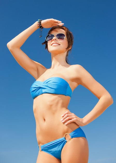 picture of beautiful woman in bikini and sunglasses