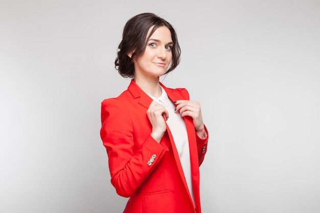 Picture of beautiful woman in red blazer standing