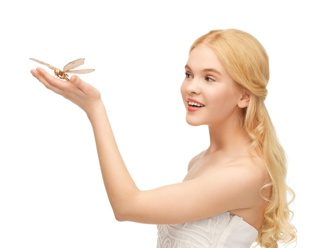 picture of beautiful woman with butterfly in hand