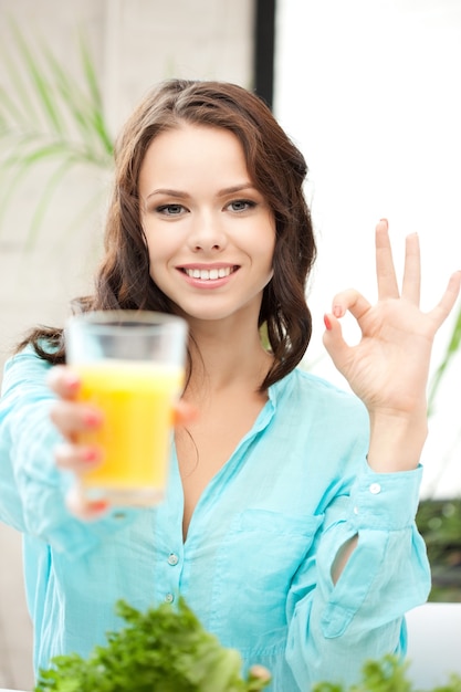 .picture of beautiful woman with glass of juice. .