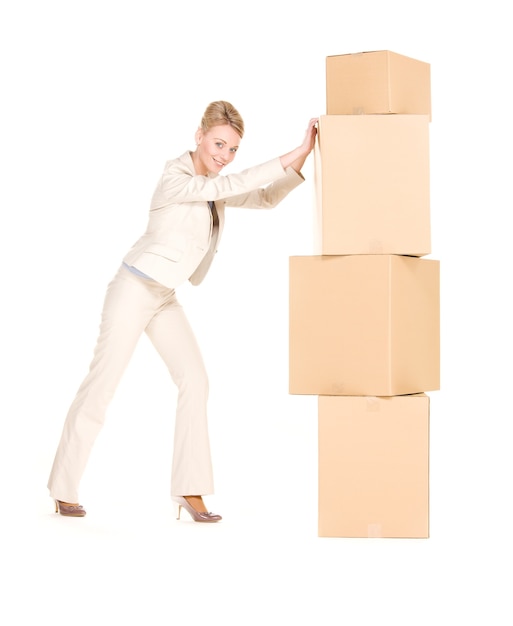 Photo picture of businesswoman with boxes over white