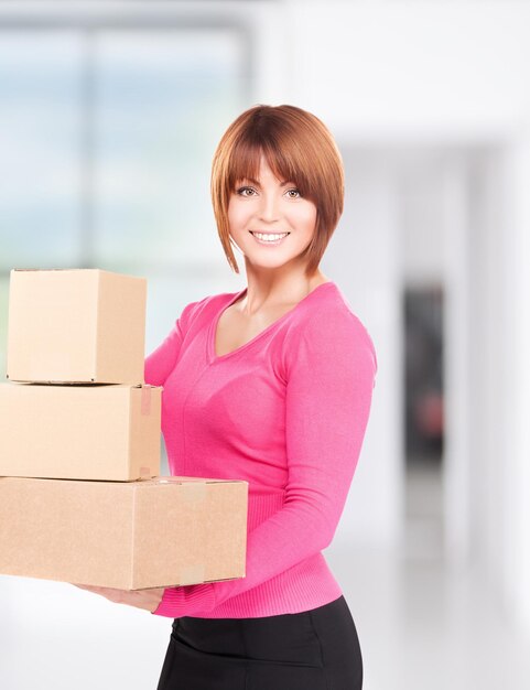 Picture of businesswoman with parcels in office