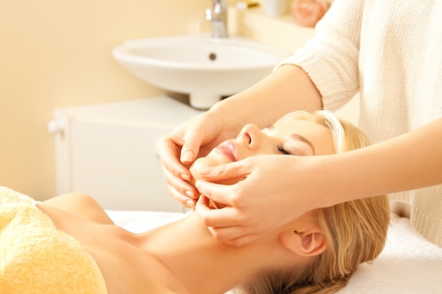 picture of calm beautiful woman in massage salon