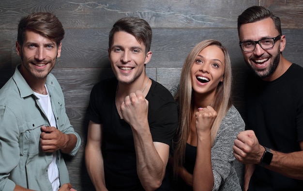 A picture of a cheerful business team outside building