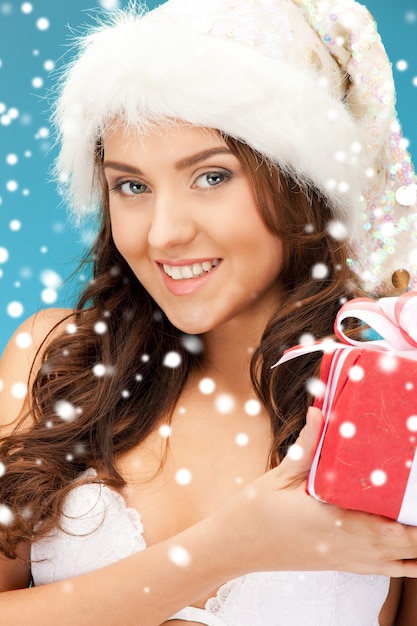 picture of cheerful santa helper girl with gift box