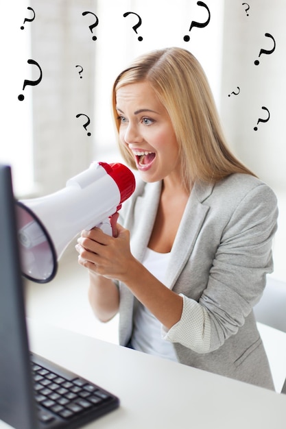 picture of crazy businesswoman shouting in megaphone