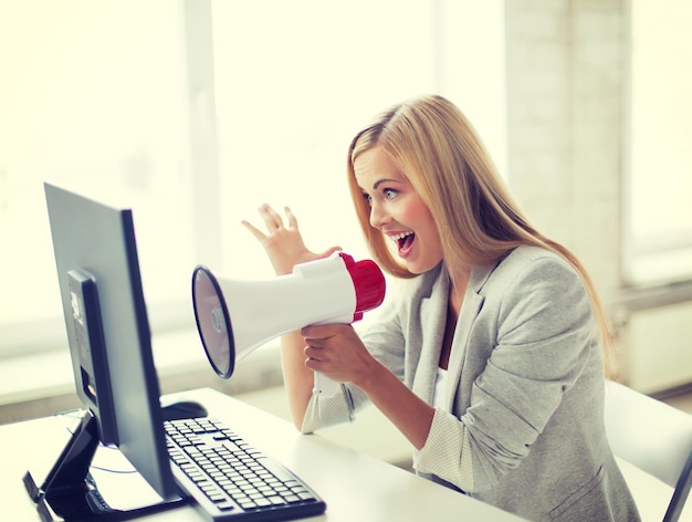 picture of crazy businesswoman shouting in megaphone