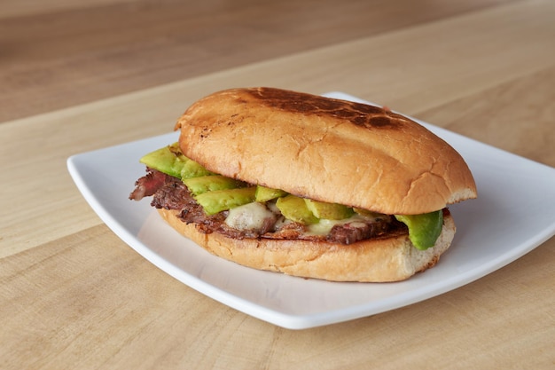 Picture of delicious sandwich or Torta with meat avocado and cheese typical mexican food torta of roast beef