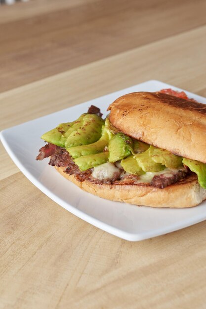 picture of delicious sandwich or torta with meat avocado and cheese typical mexican food torta of roast beef