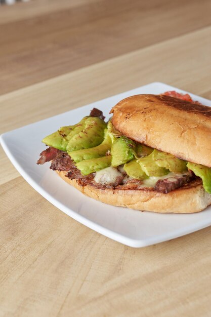 Picture of delicious sandwich or Torta with meat avocado and cheese typical mexican food torta of roast beef