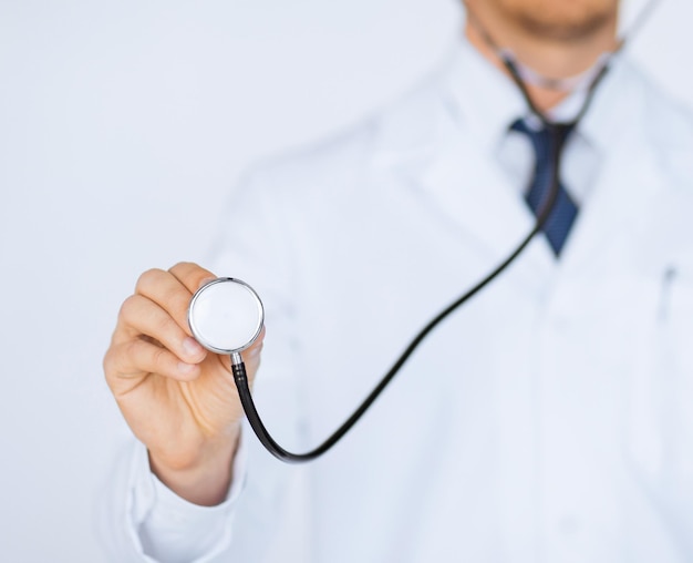 picture of doctor hand with stethoscope listening something