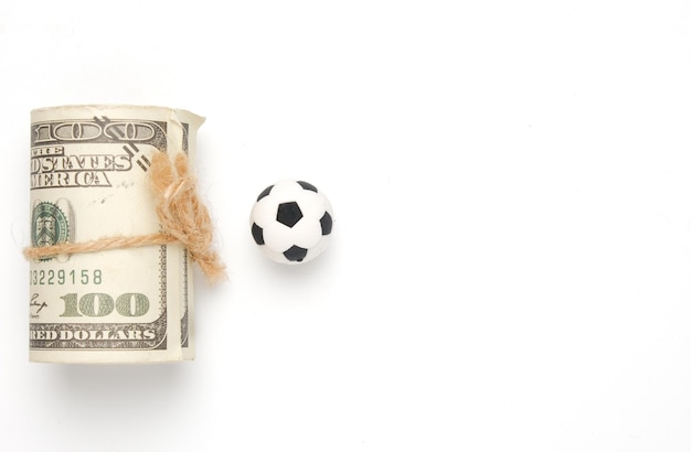 Photo a picture of fake money with football ball on copyspace white background football business and investment concept
