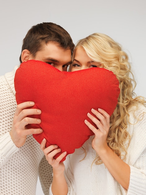 picture of family couple in a sweaters with heart