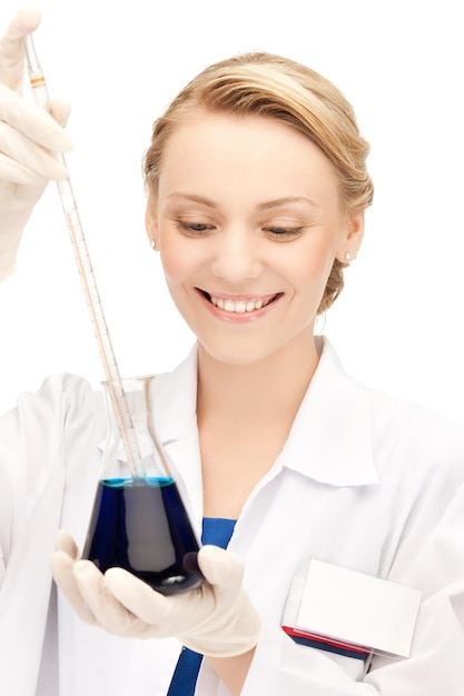 picture of female chemist holding bulb with chemicals