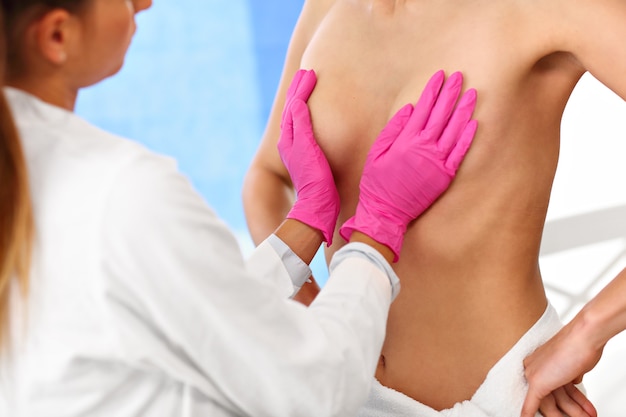 Picture of female doctor examining breast