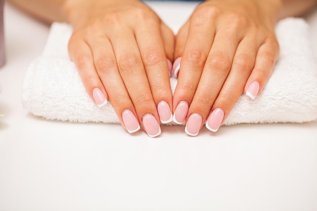 The picture of female hands with perfectly done manicure