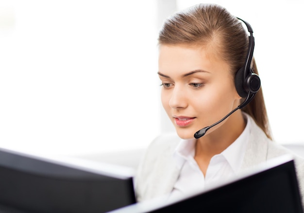 picture of friendly female helpline operator with headphones