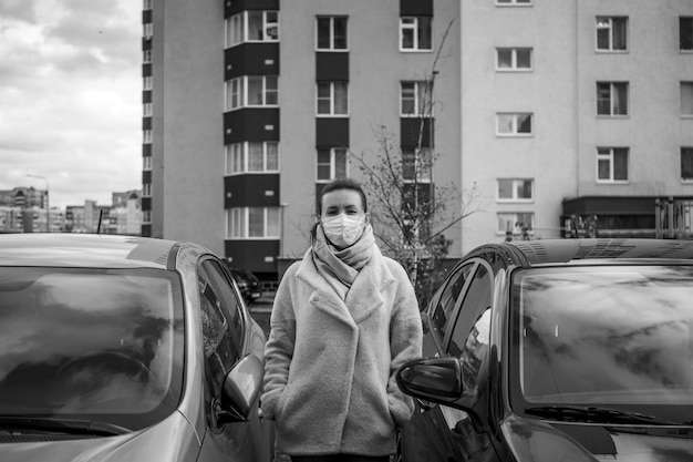 Photo picture of a girl in a mask on the street isolated covid19 pandemic