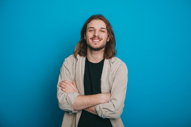 The picture of a glad man with crossed arms