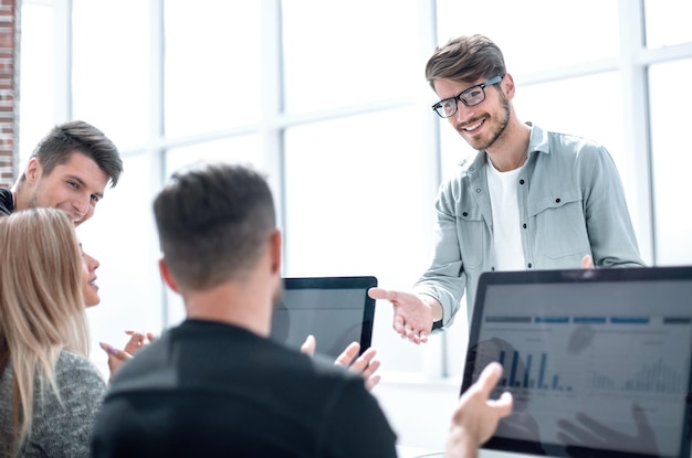 Picture handsome businessman showing graphs charts