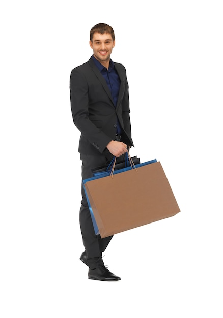 picture of handsome man in suit with shopping bags.