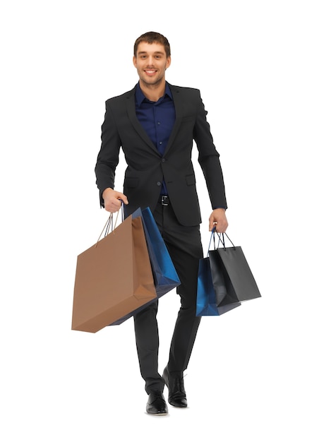 picture of handsome man in suit with shopping bags.