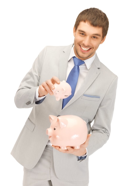 picture of handsome man with two piggy banks...