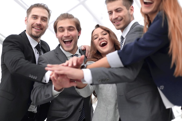 Picture of happy business team celebrating victory in office