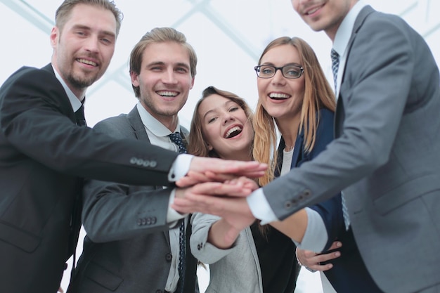 Picture of happy business team celebrating victory in office