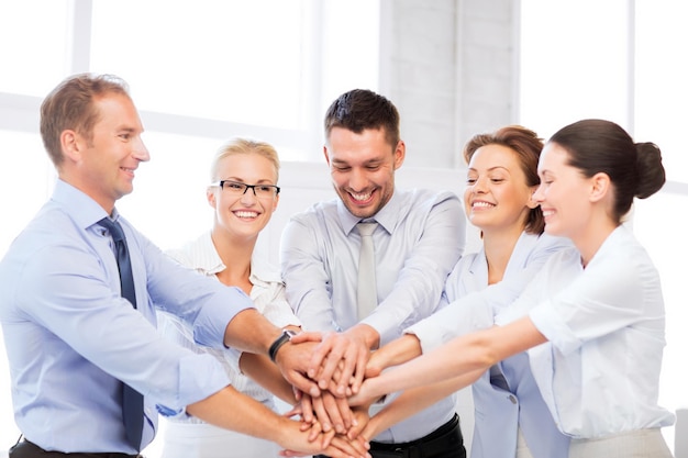 picture of happy business team celebrating victory in office