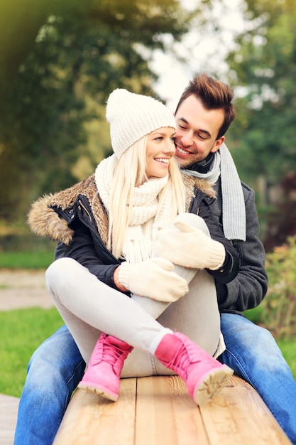 A picture of a happy couple on a date in the park