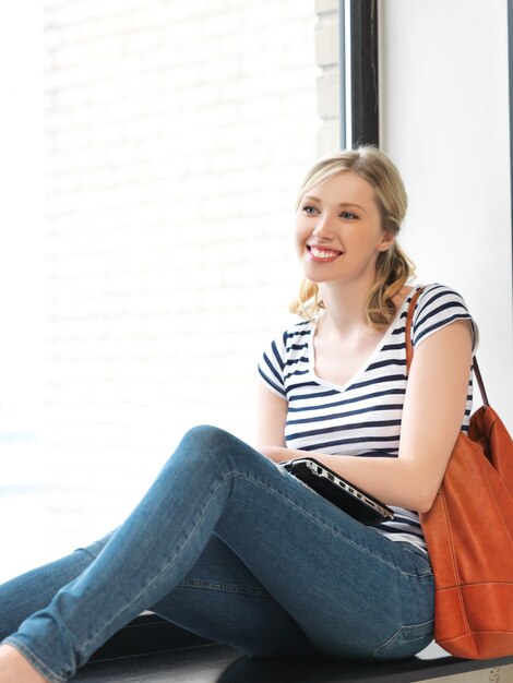 picture of happy and smiling teenage girl with laptop