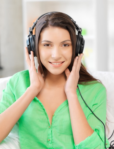 picture of happy teenage girl in big headphones