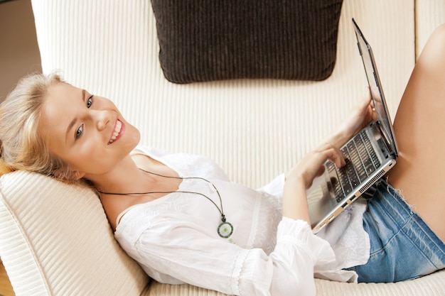 picture of happy teenage girl with laptop computer