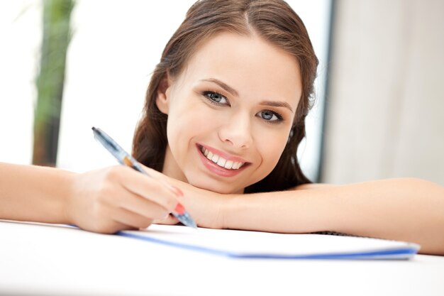 picture of happy woman with big notepad