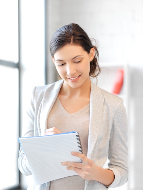 picture of happy woman with big notepad